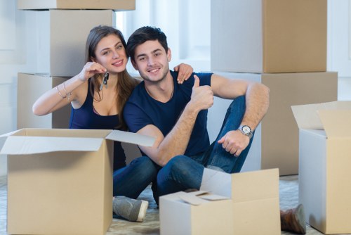 Moving team loading household belongings into a vehicle during a relocation service