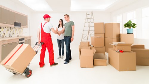 Packed household boxes and furniture ready for transport from Kensington