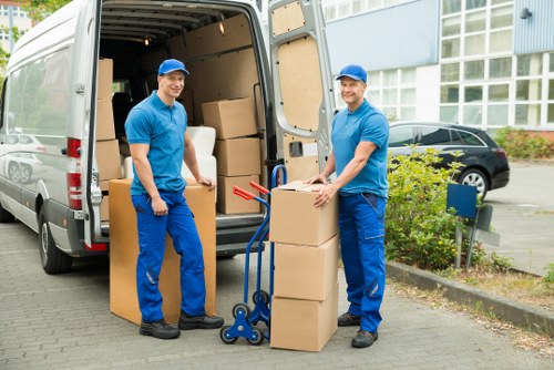 Relocation team managing furniture loading in Kensington
