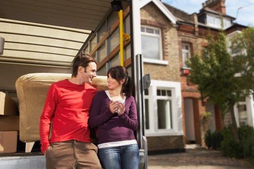Professional movers handling furniture and boxes in Kensington